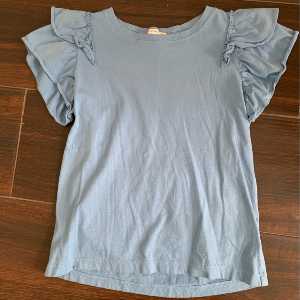 Crewcuts T-shirt with frilly shoulders. Color is light chambray blue.